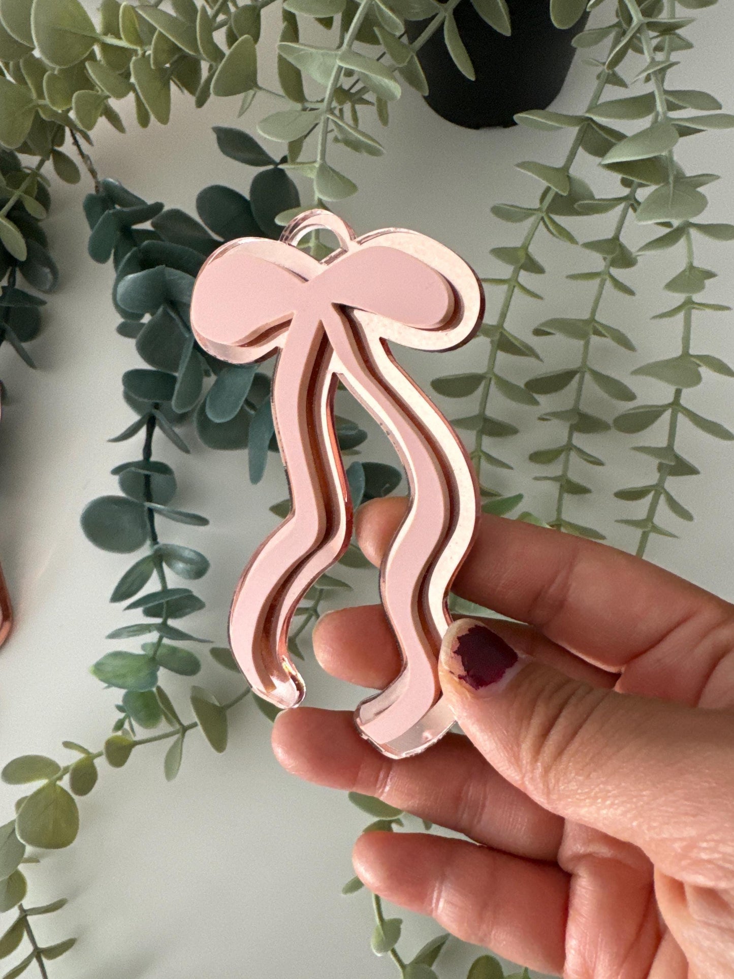feminine bow coquette laser cut digital design, long dainty ribbon bow, modern bow ornament svg file, very cutesy demure trending bow 2024